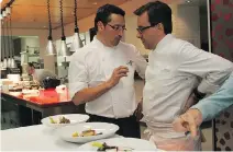  ?? MARIE-FRANCE COALLIER/FILES ?? New York star chef Daniel Boulud, right, confers with Normand Laprise at Toqué! in 2007. Alumni from Boulud’s restaurant­s will unite for a mentors’ dinner on Monday and Tuesday.