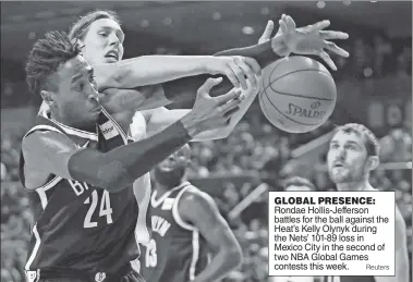  ?? Reuters ?? GLOBAL PRESENCE: Rondae Hollis-Jefferson battles for the ball against the Heat’s Kelly Olynyk during the Nets’ 101-89 loss in Mexico City in the second of two NBA Global Games contests this week.