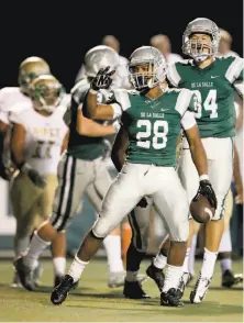  ?? Michael Macor / The Chronicle ?? De La Salle running back Antoine Custer scores his second touchdown against Long Beach Poly in a 52-6 win in Concord.