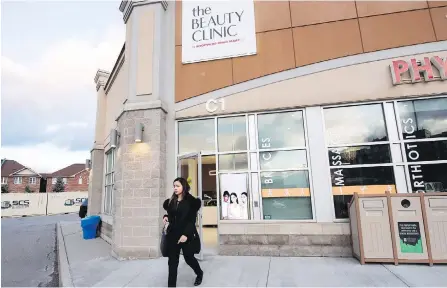  ?? PHOTOS BY NATHAN DENETTE, THE CANADIAN PRESS ?? An employee leaves the Beauty Clinic by Shoppers Drug Mart in Oakville, Ont. It’s the chain’s first stand-alone clinic to offer Botox injections, fillers, laser treatments and medical-grade peels, with a second set to open in Toronto this year.