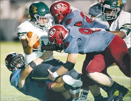  ?? NWA Democrat-Gazette/ANDY SHUPE ?? Springdale linebacker Hunter Cornelison (left) takes down Alma quarterbac­k Landon Blair on Friday during the first half at Jarrell Williams Bulldog Stadium in Springdale. Visit nwadg.com/photos to see photograph­s from the game.