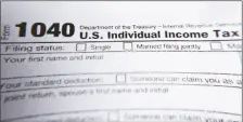  ?? ASSOCIATED PRESS ?? THIS FEB. 13, 2019 FILE PHOTO shows part of a 1040 federal tax form printed from the Internal Revenue Service website.