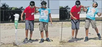  ?? Katharine Lotze/The Signal (See additional photos on signalscv.com) ?? Anish Jain, 11, left, and Rashik Pulipaka, 11, launch an air pressure-powered “rocket” as part of a Leona Cox Elementary GATE Academy project on Thursday.