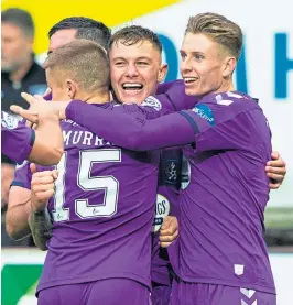  ?? ?? Kilmarnock’s Callum Hendry celebrates his goal with team-mates