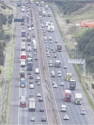  ??  ?? ●●Motorists using the M62 have found the new stretch including the fourth lane ‘littered’ with potholes