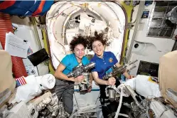  ?? NASA via AP ?? ■ U.S. astronauts Jessica Meir, left, and Christina Koch pose for a photo Thursday in the Internatio­nal Space Station.