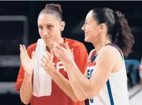  ?? KEVIN C. COX/GETTY ?? Diana Taurasi and Sue Bird celebrate their win over Serbia in a semifinal game on Friday at the Tokyo 2020 Olympic Games at Saitama Super Arena in Saitama, Japan.