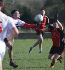  ??  ?? Darren McMullen and James Costello compete for a loose ball.