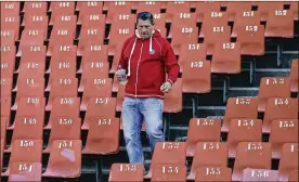  ?? AP ?? Former rugby player James Small walks down the stairs during the 1995 Rugby World Cup-winning team’s reunion in 2015 at Ellis Park stadium in Johannesbu­rg, South Africa. Small was the rebel in the ultra-conservati­ve world of South African rugby in the early 1990s. At a time when South Africans were breaking through the barriers of apartheid, people loved him for it. Even Nelson Mandela. Small died last week at the age of 50.