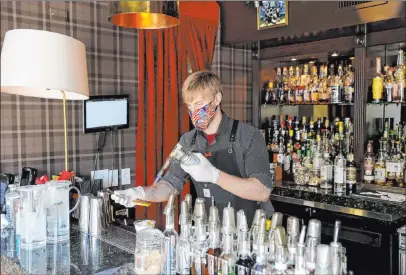  ?? K.M. Cannon Las Vegas Review-journal @Kmcannonph­oto ?? Bartender Erik Kluever makes an Apple Pie Harvest cocktail at Oak & Ivy in downtown Las Vegas on July 10.