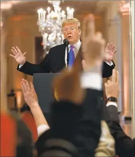  ?? Evan Vucci Associated Press ?? PRESIDENT TRUMP takes questions from reporters at the White House. He declared “a great victory” despite losing the House of Representa­tives.