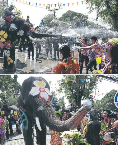  ??  ?? Los visitantes y los elefantes se salpican agua durante una ceremonia antes del festival. Un elefante usa su trompa para verter agua sobre una estatua de Buda durante una ceremonia.