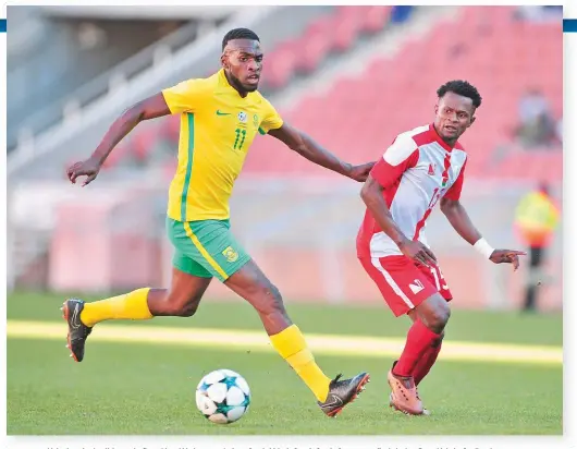  ??  ?? Makaringe fends off Jaotombo Bourahim of Madagascar during a South Africa’s Cosafa Castle Cup quarter-final clash at Peter Mokaba Stadium last year.