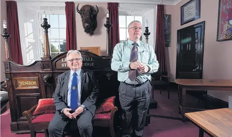  ?? GUZELIAN ?? David Jerman (left) and Barrie Kingston at the order’s headquarte­rs in Harrogate. They deny the Royal Antediluvi­an Order of Buffaloes is a secret society pulling the levers of power. Below, stills from the Beyoncé tour video showing the order’s medal