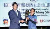  ??  ?? Gateway Under-14 skipper receives the trophy