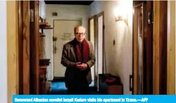  ??  ?? Renowned Albanian novelist Ismail Kadare visits his apartment in Tirana.—AFP