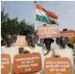  ?? AFP ?? People for the Ethical Treatment of Animal activists wear elephant masks during a protest, calling on the government for an end to elephants rides, in New Delhi on Wednesday. —