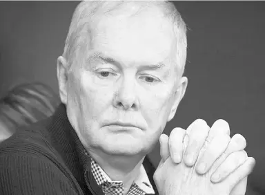  ?? Jonathan Hayward / The Canadian Pres ?? John Furlong pauses for a moment from his lawyer’s office in Vancouver on Tuesday. The former Vancouver Olympics boss says he has been vindicated by the courts
after the last of three sexual abuse lawsuits was discarded Monday.