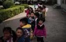  ?? Eisele/AFP/Getty Images ?? Children playing in a schoolyard in Rudong, Jiangsu province. Photograph: Johannes