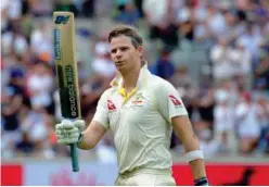  ?? Reuters ?? ↑ Australia’s Steven Smith celebrates after scoring his second century of the match against England in the first Ashes Test on Sunday.