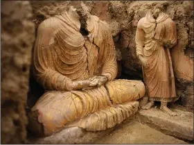  ?? (File Photo/AP/Dusan Vranic) ?? Buddha statues are seen Oct. 12, 2010, inside an ancient temple in Mes Aynak valley.