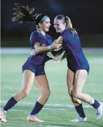  ?? JOHN MCCALL/SOUTH FLORIDA SUN SENTINEL PHOTOS ?? University School’s Giana Ricco celebrates with Taylor Smith after beating Miami Edison during a regional final in Davie on Wednesday.