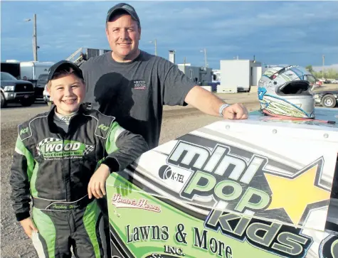  ?? PHOTOS BY BERND FRANKE/POSTMEDIA NEWS ?? Tucker Wood, left, and father Brett in the Mod Lites pit area at Merrittvil­le Speedway in Thorold. Though only 12, Tucker is an old hat when it comes to racing. He began competing in karts as a four-year-old.