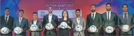  ??  ?? Nita Ambani (centre),
ISL founder and chairperso­n, poses with key retained players during the draft session on Sunday.