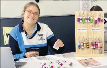  ??  ?? PRODUCTS FOR PURPOSE: Marian College year-12 student Abby Bligh sells keyrings she created for an employabil­ity project. All money raised from the project will be delivered to MND Australia. Picture: DYLAN DE JONG
