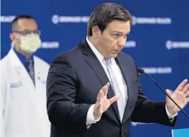  ?? AMY BETH BENNETT/SOUTH FLORIDA SUN SENTINEL ?? Gov. Ron DeSantis speaks during a news conference regarding COVID-19 at Broward Health’s Corporate Office in Fort Lauderdale on Monday.