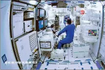  ?? JIN LIWANG / XINHUA ?? Astronauts enter the core module of China’s space station from the Shenzhou XII spacecraft on Thursday. The crew have started to prepare their orbiting residence for operations for the next three months.