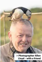  ??  ?? > Photograph­er Allen Lloyd – with a friend