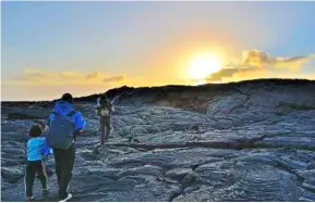  ??  ?? the writer and her family hiked until sundown — and beyond — over rough terrain to get close to a lava flow.