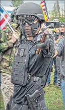  ??  ?? An armed demonstrat­or at a rally in Oregon, USA