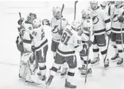  ?? ELSA/GETTY ?? The Lightning celebrate a 3-1 victory against the Bruins in Game 4 of the Eastern Conference second-round playoff series Saturday at Scotiabank Arena in Toronto. The Lightning lead the series 3-1.