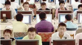  ?? — Reuters ?? Customers use computers at an Internet cafe in Taiyuan, Shanxi province, China.