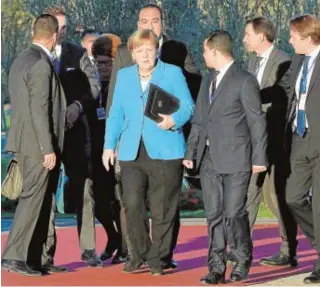  ?? REUTERS ?? Merkel, a su llegada a la sede de la reunión en Marruecos