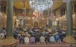  ?? (AP/Dar Yasin) ?? Kashmiri Muslims pray inside the shrine of Shah-e-Hamadan during the holy fasting month of Ramadan in Srinagar, Indian controlled Kashmir, on Wednesday. Muslims across the world are marking the holy month of Ramadan, a period of intense prayer, self-discipline, dawn-to-dusk fasting and nightly feasts.