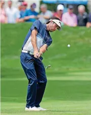  ?? [AP PHOTO] ?? Bubba Watson hits his approach shot onto the second green during the final round of the Travelers Championsh­ip Sunday in Cromwell, Conn.