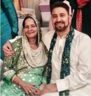  ??  ?? Grieving: MP Afzal Khan with his mother Akhtar, who died of Covid