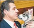  ??  ?? OFFICE OF GOV. ANDREW M. CUOMO Gov. Cuomo, in signing law, said pets are like family members.