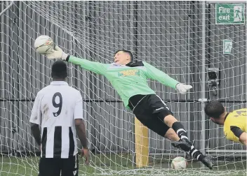  ?? PICTURE: TIM GATES ?? Dan George makes a great save during Peterborou­gh Northern Star’s UCL Premier Division defeat at Holbeach.