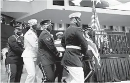  ?? MICHAEL M. SANTIAGO/GETTY ?? Pallbearer­s carry the casket holding former U.S. Rep. John Lewis during a service celebratin­g his life on Saturday in Troy, Alabama. Ceremonies are planned for the next six days.