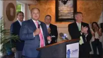  ??  ?? Cole McCaskill, Vice President of Economic Developmen­t with the Hot Springs Metro Partnershi­p, second left, speaks recently in celebratio­n of the 100th business to open in Downtown Hot Springs since the Majestic Hotel Fire in 2014. U.S. Senator John...