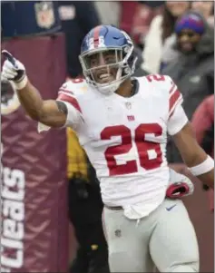  ?? JOHN BLAINE — FOR THE TRENTONIAN ?? Giants running back Saquon Barkley (26) celebrates after his 78-yard touchdown against the Redskins in Week 14.