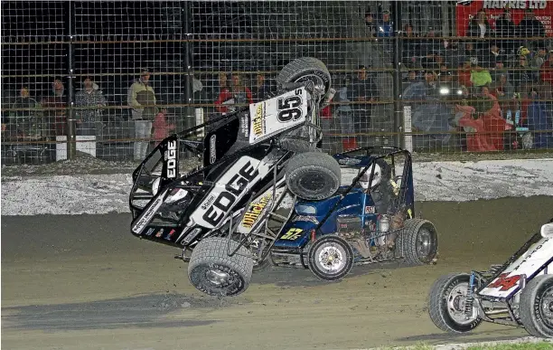  ?? Photo: ANDREW HAMBLYN ?? Crashing. It’s a part of racing and something that the Stratford Speedway crowd loves. Midget racer Duane Hickman will be hoping not to do this again.
