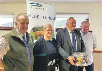  ??  ?? Kate and Donnie with outgoing NFUS regional chairman John Dickson, left, and new chairman Duncan Macalister on the right.