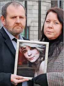  ?? ?? HEARTBROKE­N: Eve’s parents Barry Cleary and Melanie Sheehan Cleary with a photo of their daughter