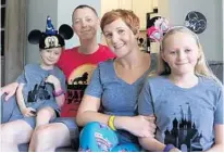  ?? CHARLES KING/STAFF PHOTOGRAPH­ER ?? Winter Garden residents Robert and Candi Clark — formerly of Loganville, Ga. — have Disney World season passes and make frequent trips there with their children, Ryan, 5, and Ansley, 11.