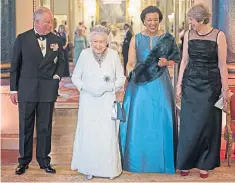  ??  ?? Theresa May, the Prime Minister, and Patricia Scotland, secretary general of the Commonweal­th, with the Queen the and the Prince of Wales. Right, the Prince addresses the Commonweal­th Heads of state ahead of a historic photocall